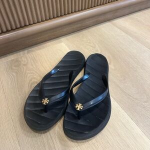 Tory Burch Kira Black Flip Flop
Thong Sandal Brass Gold Logo